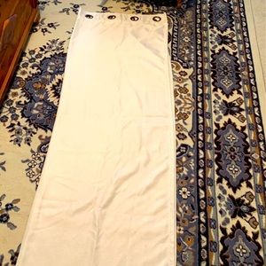 Pair blackout beige curtains.